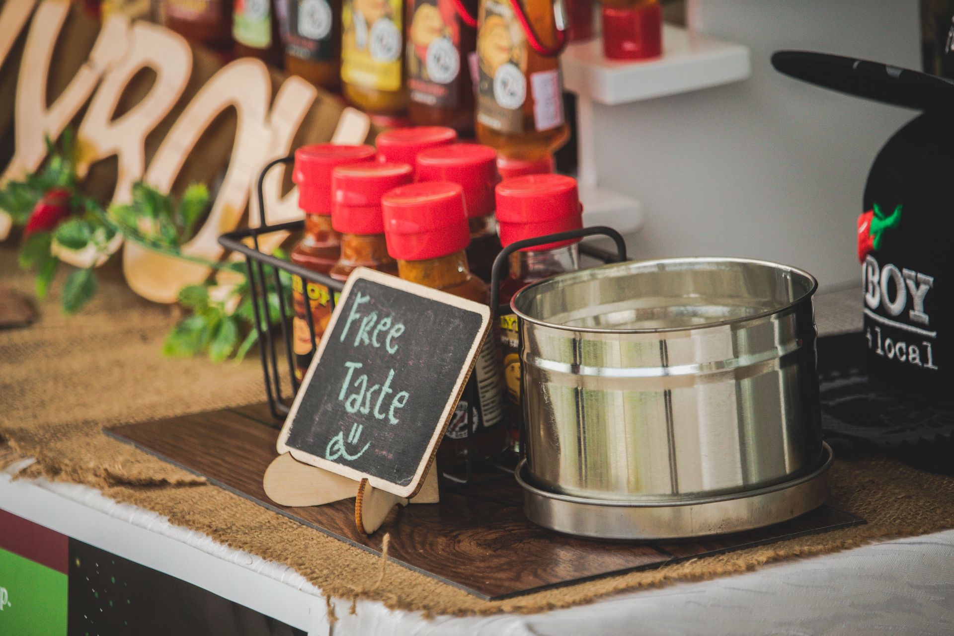 A 'Free Taste' sign on a market counter